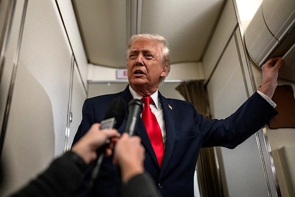 President Donald Trump answers questions from members of the media aboard Air Force One en route to Mount Pocono, Pennsylvania, for a rally on the economy, Tuesday, December. 9, 2025. (Official White House photo by Molly Riley)