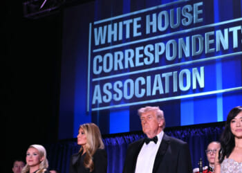 White House Press Secretary Karoline Leavitt, US First Lady Melania Trump, US President Donald Trump and CBS News senior White House correspondent Weijia Jiang stand in front of a blue backdrop reading "White House Correspondents' Dinner."