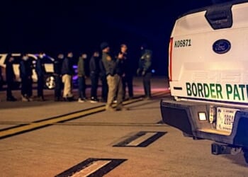 U.S. Customs and Border Protection agents guide illegal aliens to board C-17 Globemaster III aircraft at the Tucson International Airport, Arizona, Thursday, Jan. 23, 2025. (U.S. Dept. of Defense photo by Senior Airman Devlin Bishop)