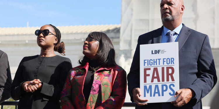 (L-R) Janai Nelson, Terri Sewell and Ambrose Sims attend the rally as activists and participants gather in front of the Supreme Court of the United States during Supreme Court re-argument of Louisiana v. Callais on October 15, 2025 in Washington, DC. (Jemal Countess/Getty Images for Legal Defense Fund)