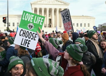 Pro-life protestors holding signs