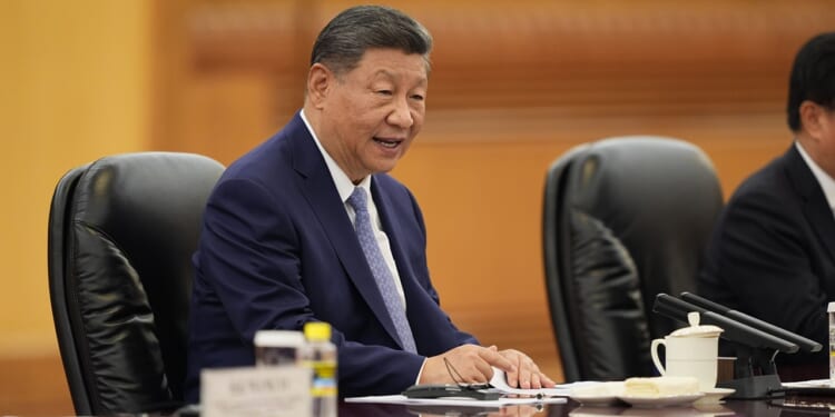Chinese President Xi Jinping seated