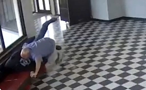 School-shooting suspect Victor Lee Hawkins being tackled by principal Kirk Moore (Video screenshot)