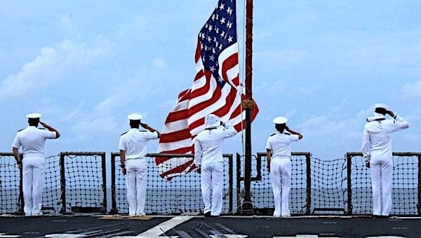 Sailors aboard the Arleigh Burke-class guided-missile destroyer USS Rafael Peralta render honors during a remembrance ceremony for the Solomon Islands campaign with the Japanese Maritime Self Defense Force Takanami-class destroyer JS Makinami on June 27, 2021. (U.S. Navy photo by Information System Technician 2nd Class Melanie Ocasio)