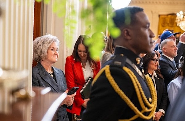 Chief of Staff Susie Wiles, left, listens as President Donald Trump delivers remarks at an event celebrating the 2024 World Series Champion Los Angeles Dodgers, Monday, April 7, 2025, in the East Room of the White House. (Official White House Photo by Daniel Torok)