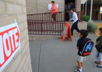 PHOENIX - NOVEMBER 4: Children look at a polling place located at their school in the home state of Republican presidential nominee U.S. Sen. John McCain (R-AZ) November 4, 2008 in Phoenix, Arizona. Voting is underway in the U.S. presidential elections with Democratic presidential nominee Sen. Barack Obama (D-IL) leading in the polls against the Republican presidential nominee Sen. John McCain (R-AZ). (Photo by David McNew/Getty Images)