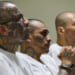 Prison inmates listen during a massive hearing against criminals and gang members at CECOT.