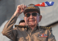 Raul Castro waves the Cuban flag.
