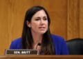 Sen. Katie Britt, seated