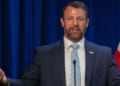 Markwayne Mullin speaks to reporters.