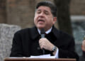 Illinois Gov. JB Pritzker delivers a short speech during a Veterans Day ceremony at Little Village's Manuel Perez Jr. Memorial Plaza on November 11, 2025 in Chicago, Illinois. After being criticized for a photo-op with other federal immigration agents in downtown Chicago on November 10th, Gregory Bonino, the top Border Patrol official leading the charge on the Trump administration's immigration crackdown in Chicago, invited the governor to Little Village. (Photo by Abel Uribe/Getty Images)