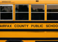 Side of a yellow Fairfax County Public Schools bus.