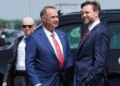 Missouri Governor Mike Kehoe (L) welcomes Vice President JD Vance as he arrives at Kansas City International Airport on May 18. (Eric Lee/Getty Images)