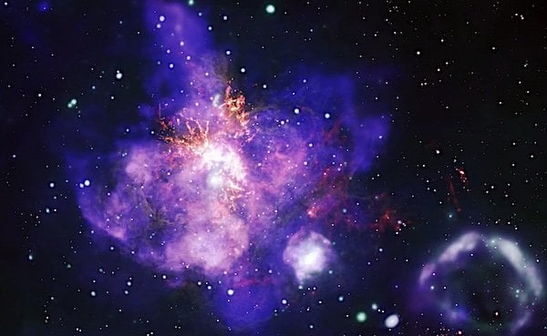 This image, released on Feb. 12, 2025, is the deepest X-ray image ever made of the spectacular star forming region called 30 Doradus. (X-ray: NASA/CXC/Penn State Univ./L. Townsley et al.; Infrared: NASA/JPL-CalTech/SST; Optical: NASA/STScI/HST; Radio: ESO/NAOJ/NRAO/ALMA; Image Processing: NASA/CXC/SAO/J. Schmidt, N. Wolk, K. Arcand)