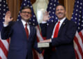 U.S. Speaker of the House Rep. Mike Johnson (R-LA) (L) participates in a ceremonial swearing-in with Rep. Josh Brecheen (R-OK) at the U.S. Capitol on January 3, 2025 in Washington, DC.
