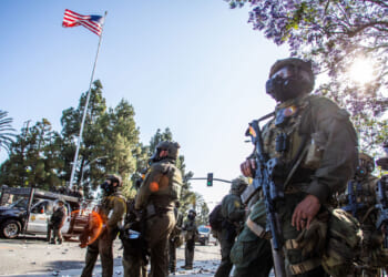 U.S. Border Patrol and protesters clash after a raid was conducted by Immigration and Customs Enforcement June 7, 2025.