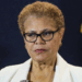 Karen Bass stands with a straight face.
