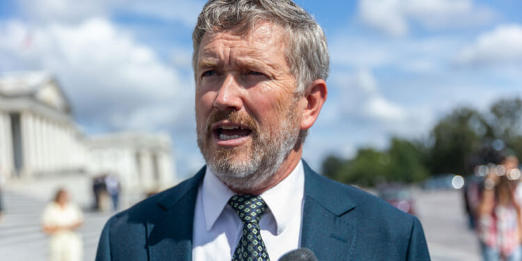 Thomas Massie speaks to reporters outside of the capitol.