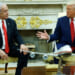 Donald Trump gestures to Benjamin Netanyahu as they sit in the Oval Office.