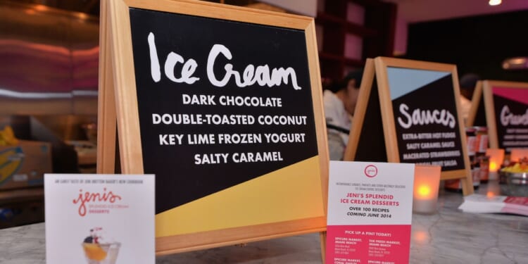 Signs advertise ice cream at a food festival.