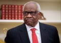 Justice Clarence Thomas frowning