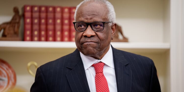 Justice Clarence Thomas frowning