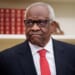 Justice Clarence Thomas frowning