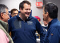 Republican Derek Merrin smiles as he talks with Bernie Moreno and Alex Triantafilou.