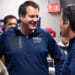 Republican Derek Merrin smiles as he talks with Bernie Moreno and Alex Triantafilou.