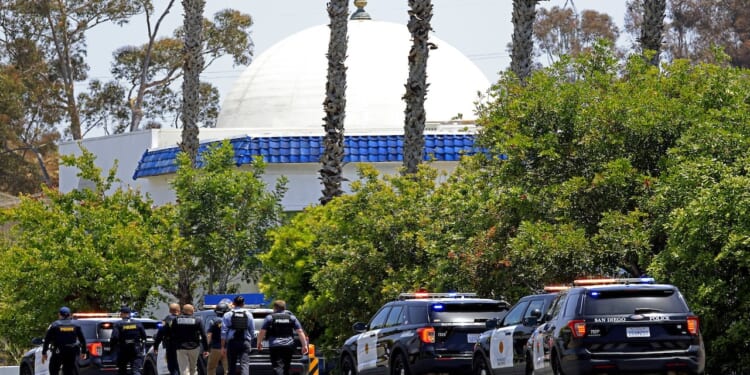 Law enforcement officers surround the Islamic Center of San Diego after reports of a shooting.