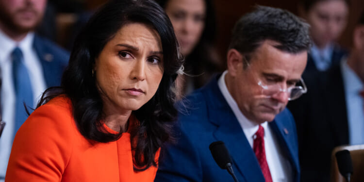 Tulsi Gabbard and John Ratcliffe speak to members of Congress in a hearing.