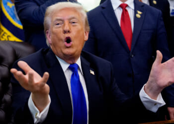 President Donald Trump speaks to reporters in the Oval Office.