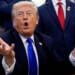 President Donald Trump speaks to reporters in the Oval Office.