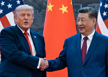 President Donald Trump (R) shakes hands with China's President Xi Jinping. (Kenny Holston/ AFP/Getty Images)