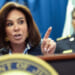 Close-up of Jeanine Pirro speaking at podium and pointing with her left hand.