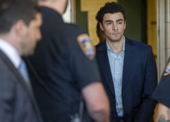 Luigi Mangione walking into court