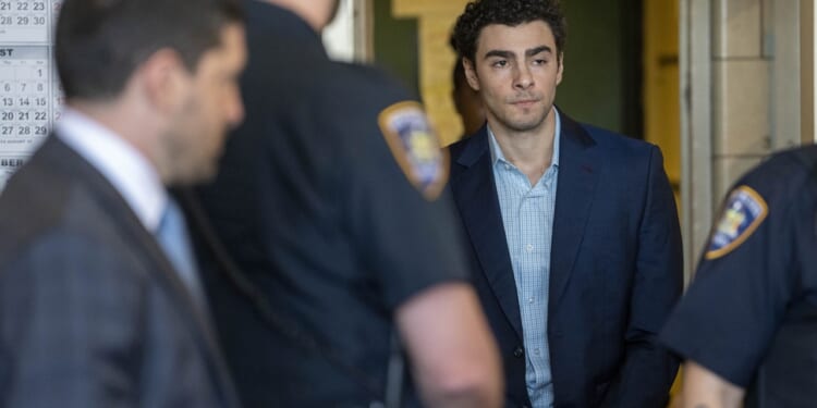 Luigi Mangione walking into court
