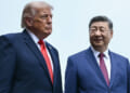 Waist-high shot of President Donald Trump and Chinese President Xi Jinping against a pale blue sky.