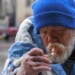 A man lighting a cigarette