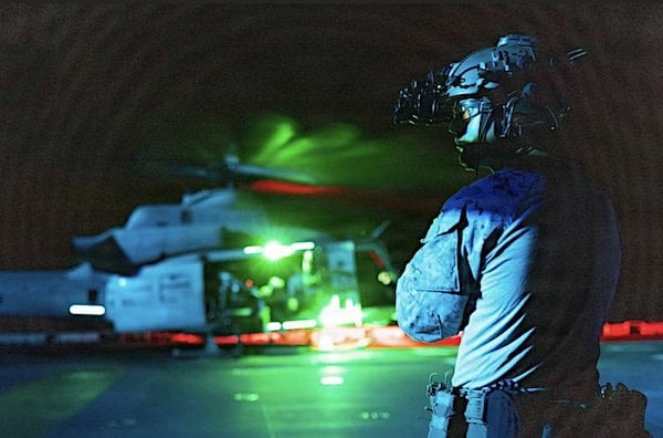 A Marine assigned to the Maritime Raid Force, 11th Marine Expeditionary Unit, observes the flight deck during fast-rope training aboard the amphibious assault ship USS Boxer in the South China Sea, Thursday, June 4, 2026. (U.S. Marine Corps photo by Sgt. Trent A. Henry)