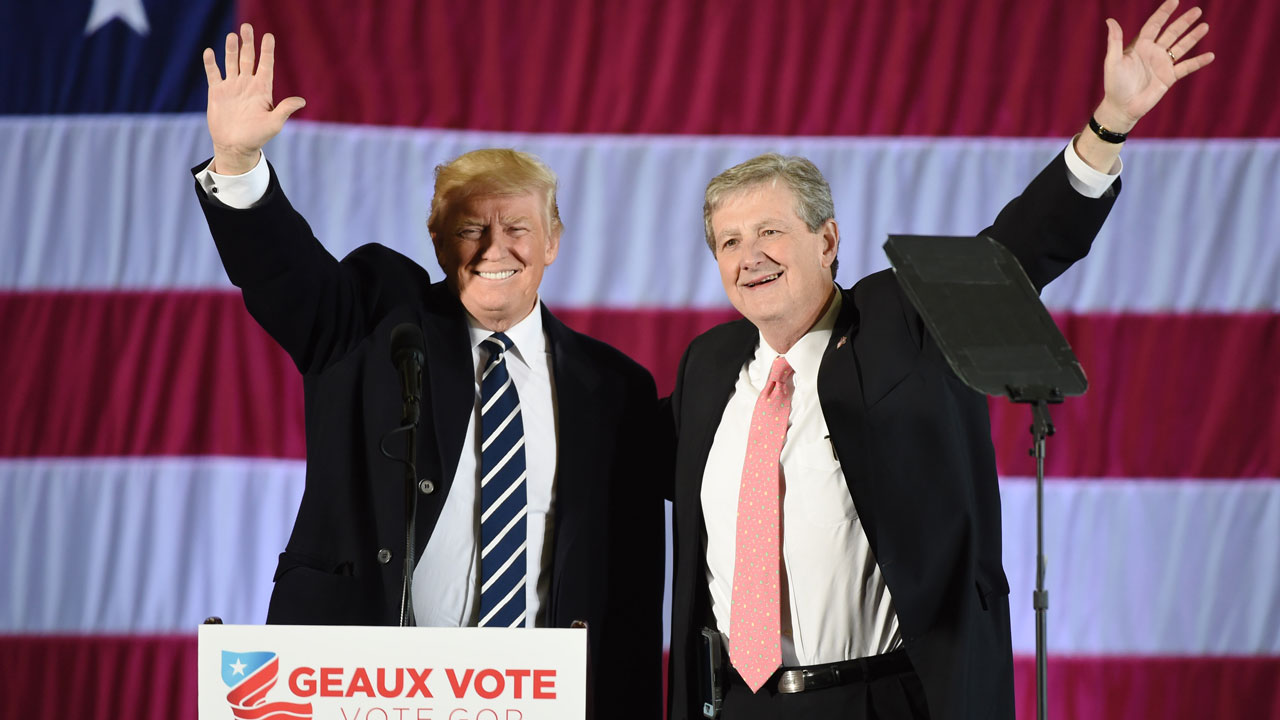 Donald Trump stands beside Louisiana Treasurer and Republican Senate candidate John Kennedy.