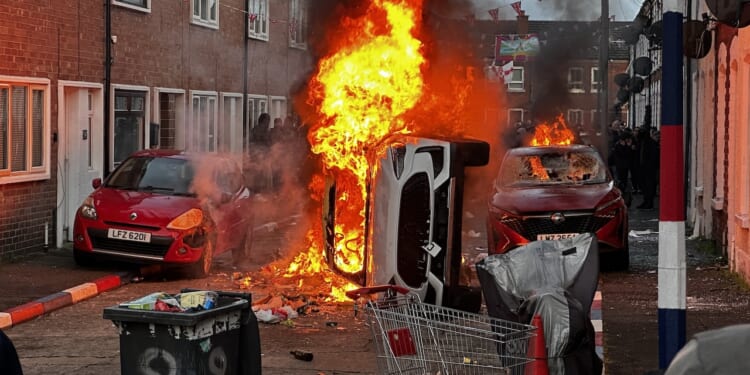 Vehicles burn in fire as riots flared in response to Monday night's stabbing attack in Belfast, Ireland.