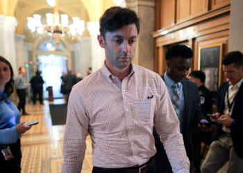 Sen. Jon Ossoff heads for a vote at the U.S. Capitol.