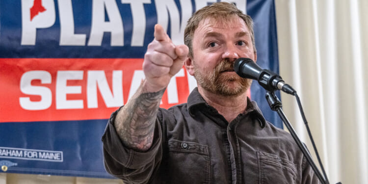 Graham Platner speaks to supporters at a rally.