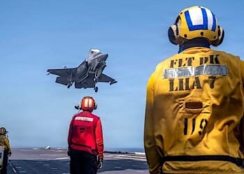 U.S. Sailors observe as a Marine Corps F-35B stealth fighter lands on the flight deck of USS Tripoli (LHA 7) while transiting the Arabian Sea on Saturday, May 30, 2026. (U.S. Central Command photo)