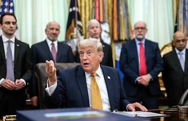 President Donald J. Trump, joined by Secretary of War Pete Hegseth, Physicist John M. Martinis, Science and Technology Policy Director Michael Kratsios, Secretary of Commerce Howard Lutnick, Secretary of Energy Chris Wright, OMB Director Russ Vought, and others, delivers remarks after signing an executive order on quantum computing in the Oval Office, Monday, June 22, 2026. (Official White House photo by Joyce N. Boghosian)