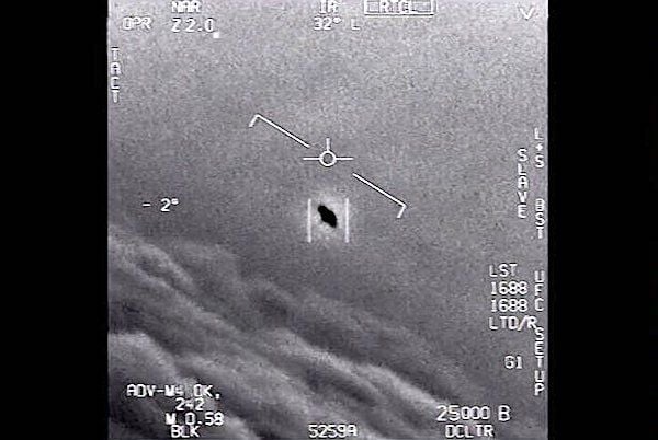 In an image from video provided by the Department of Defense labelled Gimbal, from 2015, an unexplained object is seen at center as it is tracked as it soars high along the clouds, traveling against the wind. (U.S. Department of Defense)