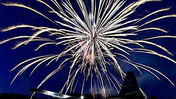 Fireworks light up the sky above a C-130H aircraft to conclude the sixth annual Liberty Fest at Little Rock Air Force Base, Arkansas, July 2, 2021. (U.S. Air Force photo)