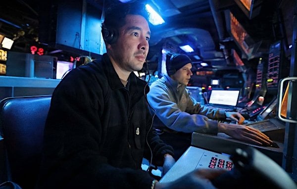 U.S. Sailors aboard guided-missile destroyer USS Michael Murphy monitor operations in the ship's Combat Information Center while transiting the Arabian Sea, as American forces enforce the naval blockade against Iran on Wednesday, July 22, 2026 (CENTCOM)