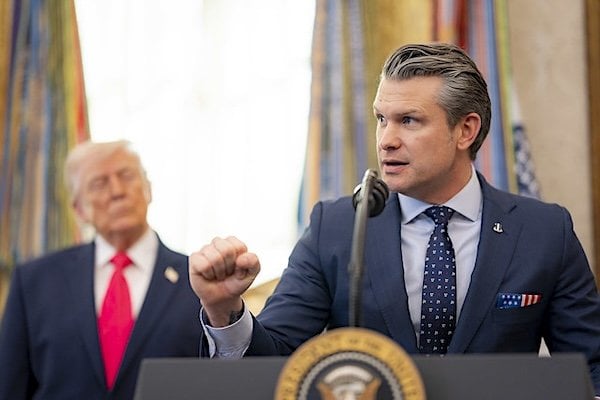 Secretary of War Pete Hegseth participates in the swearing-in ceremony for former U.S. Sen. Markwayne Mullin as he is sworn in as secretary of homeland security by Pam Bondi in the Oval Office of the White House in Washington, D.C., March 24, 2026. (DHS photo by Tia Dufour)